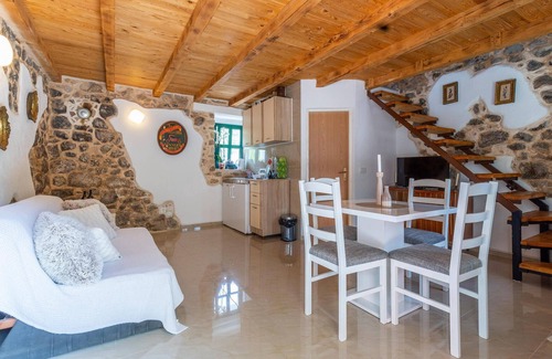 Vrgorac House | Enjoy a wonderful view of the countryside from this inviting vacation home with pool access.