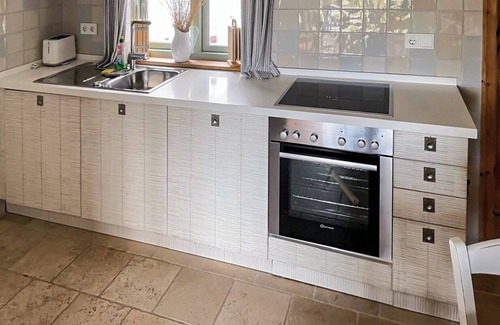 Fehmarnsund Apartment | Enjoy your vacation: Sea view, terrace & fireplace -BEACHHOUSE FEHMARN apartment Ostwind