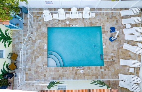 Madeira Beach Cottage | Entire Island Paradise Cottages – Heated Pool, Tiki Hut, Walk to Beach, 8 Units, Sleeps 30