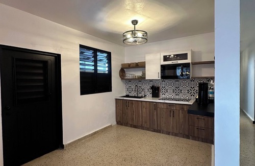 Fajardo House | Escape to Blissful Homes, where modern bohemian charm meets ultimate relaxation.