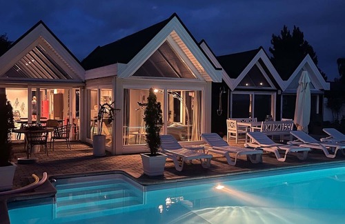 Skibby Apartment | Exclusive vacation home with panoramic sea views, heated pool & sauna in privacy