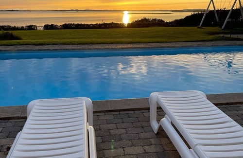 Skibby Apartment | Exclusive vacation home with panoramic sea views, heated pool & sauna in privacy