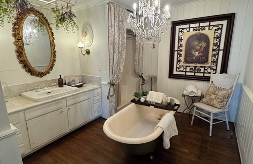 Montgomery Bed & Breakfast | Experience the historic Suite Louise with a parlor and claw tub.