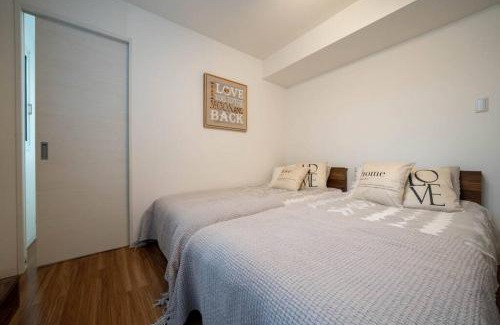 Nakajimakoen Apartment | Ferien 2LDK マスターベッドルーム・駐車場付