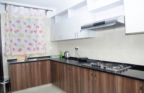 Nairobi West Apartment | Get a magnificent aerial view of the expansive Nairobi game Park from a balcony