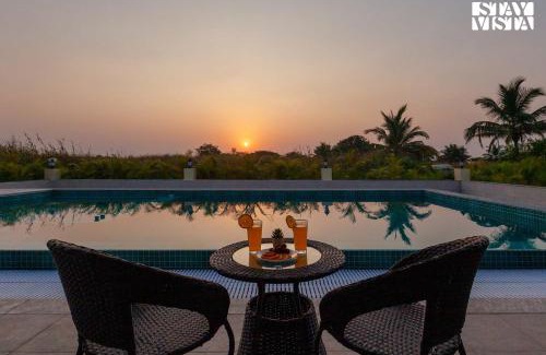 Alibaug Villa | Golden Sunsets by StayVista - Refreshing pool, serene lawn - your tranquil retreat