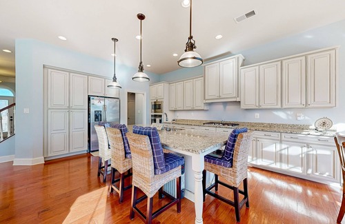 West Beach House | Gorgeous Bay Forest home with resort amenities, raised patio, office, & firepits