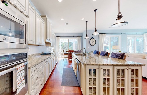 West Beach House | Gorgeous Bay Forest home with resort amenities, raised patio, office, & firepits