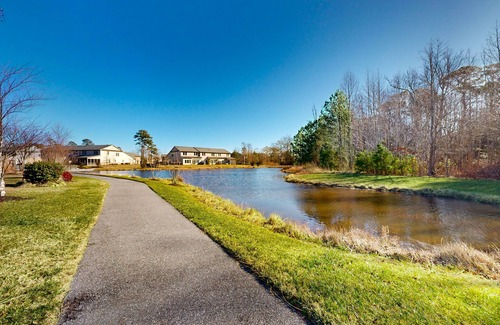 West Beach House | Gorgeous Bay Forest home with resort amenities, raised patio, office, & firepits