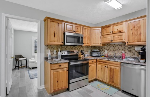 Amelia City House | Gorgeous coastal getaway with large yard, firepit, & screened porch