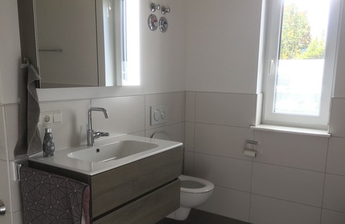 Bad Konigshofen Apartment | Ground-floor, disabled-friendly vacation apartment with small terrace, adjoining sunbathing lawn and lockable bicycle storage room