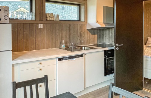 Midsund House | Gues cottage with sea view from the property.
