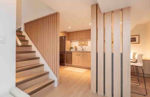 Winnipeg House | Guest suite in The Gates - Lower level luxury with sauna, workspace & fireplace