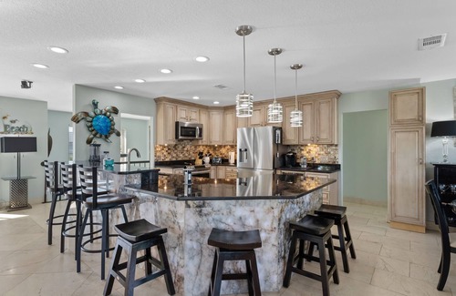 Holiday Isle House | HARBOR OASIS-WATERFRONT/BOAT/PWC SLIPS/Dock/Pool/Spa/ Kayaks/Bikes/Volleyball+
