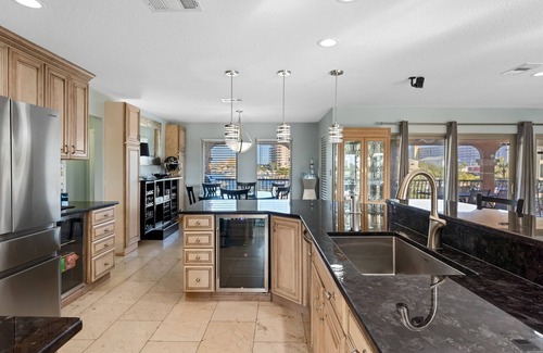 Holiday Isle House | HARBOR OASIS-WATERFRONT/BOAT/PWC SLIPS/Dock/Pool/Spa/ Kayaks/Bikes/Volleyball+