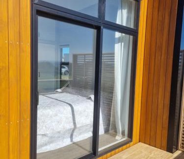 Clarks Beach Apartment | Harbour and rural views