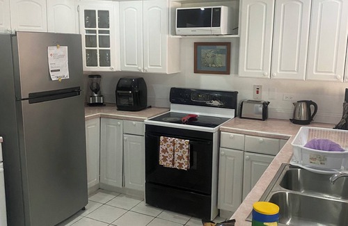 Crown Point Villa | HCeas Villa Compound is 5 min to the airport and beaches, up to 30 ppl max