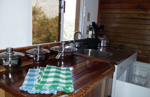 Unitedville Cabin | Heliconia is a self catering studio cabin with jungle facing private balcony