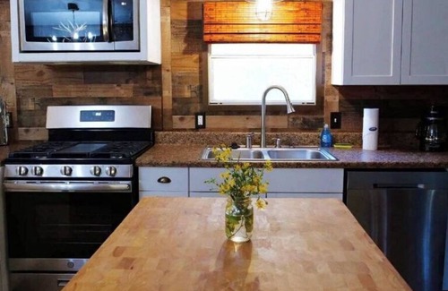 Cat Spring Cabin | Hideaway Cabin secluded & nestled in the live oaks with private outdoor Hot Tub!