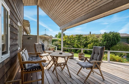 Roskilde House | Highly furnished wooden house with wood-burning stove, fjord view and boat dock.
