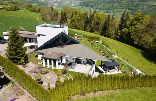 Riggisberg Villa | Hilltop Luxury Villa with Minigolf, Indoor Pool, Wellness & Spa