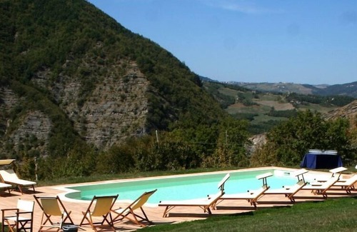 Lizzano in Belvedere House | Holiday Home in Imola with Forest & Pool