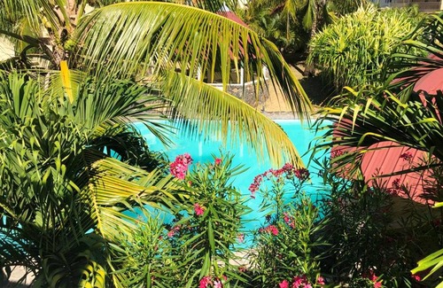 Palmar House | Homerez - Bungalow for 6 ppl. with shared pool, sea view and terrace at Palmar