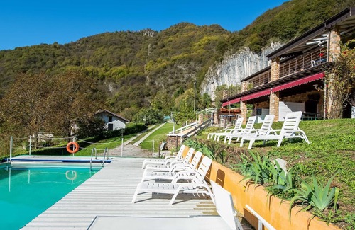 Marone Ski Chalet | In a green and relaxing atmosphere, with pool and stunning lake view.