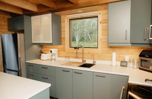 Malagash Mine House | Indulge in Serenity at The Golden Pearl: A Beautiful Log Cottage Escape