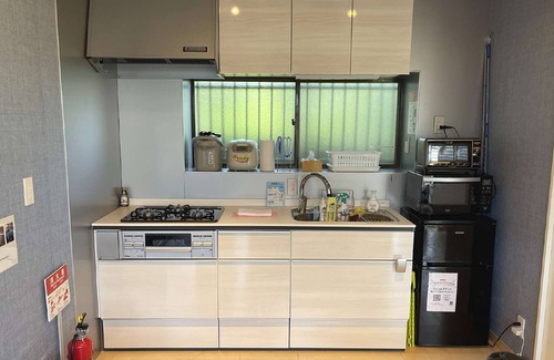 Futo Villa | Izu Kogen Ito ·BBQ with pets on the wood deck.Family cottage with hammock slide