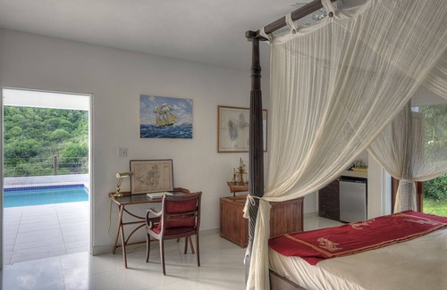 Cole Bay Bed & Breakfast | King size bedroom with direct access to garden and private swimming pool.