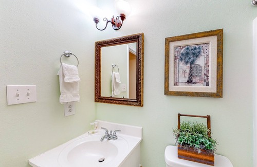 Gulf Shores Condo | Lagoon-front condo with balcony, washer/dryer, shared pool, & dock