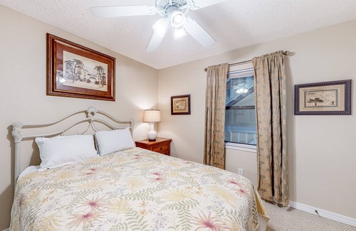 Gulf Shores Condo | Lagoon-front condo with balcony, washer/dryer, shared pool, & dock