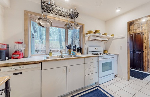 Castleton House | Lakefront home near ski resorts with water view, dock, deck, fireplaces, & W/D