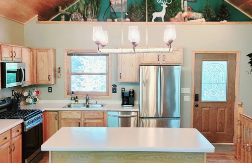 Nevis Cabin | Lakefront retreat on Island Lake. Two cabins, 7 bedrooms, sand beach, privacy+