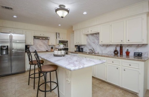 April Sound House | Lakefront Retreat with Pool, Spa, Golf, Fishing, Boat slip, Kayaks & Marina