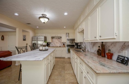 April Sound House | Lakefront Retreat with Pool, Spa, Golf, Fishing, Boat slip, Kayaks & Marina