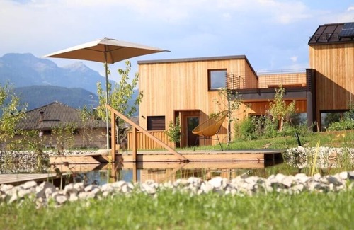 Sarnonico House | Landhaus Silene: new + modern wooden house with large natural garden and swimming pond