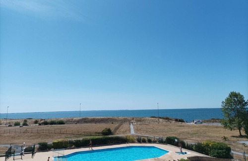 Morbihan Apartment | Large 2-bedroom apartment with sea and pool views. Beach 40 meters away.