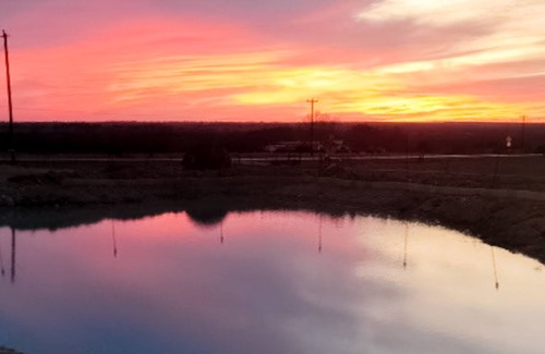 Cleburne House | Large barn on an acreage with water views, covered patios, fireplace, and AC