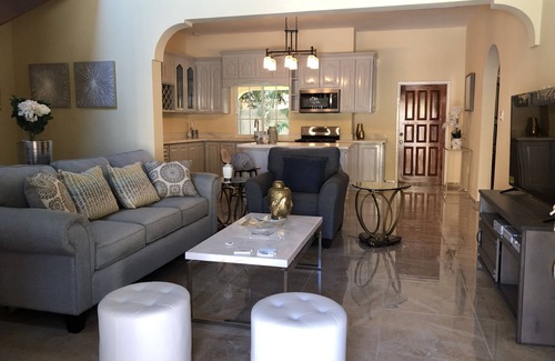 Runaway Bay Bed & Breakfast | Large Three Bedroom, Three Bathroom Apartment with Open Kitchen and Living Room
