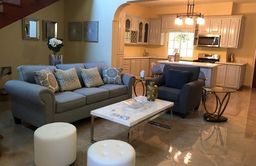 Runaway Bay Bed & Breakfast | Large Three Bedroom, Three Bathroom Apartment with Open Kitchen and Living Room