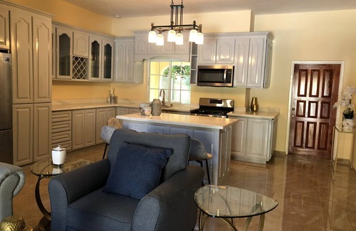 Runaway Bay Bed & Breakfast | Large Three Bedroom, Three Bathroom Apartment with Open Kitchen and Living Room