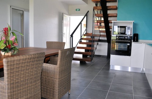 Le Moule Apartment | Lavender apartment, 3 air-conditioned bedrooms, and landscaped swimming pool