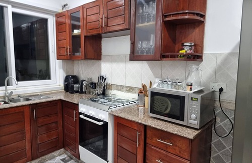 Kunduchi Apartment | Leisure and discovery Enjoy the sea breeze on a comfortable hammock.