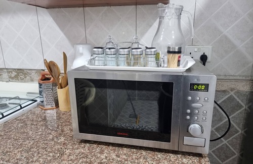 Kunduchi Apartment | Leisure and discovery Enjoy the sea breeze on a comfortable hammock.