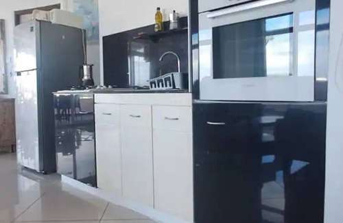 Flic-en-Flac Apartment | Loft in the center of Flic en Flac with corner terrace. 400m from the beachn