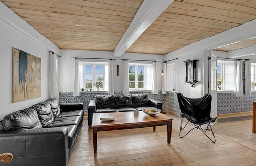 Emmerlev House | Look forward to a beautiful sea view from the terrace of this vacation home near the beach!