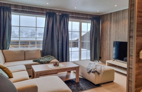 Tjaldal House | Look forward to family time together in this spacious semi-detached house with whirlpool.