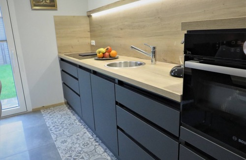 Berumbur House | Look forward to relaxing on approx. 54 square meters of living space in the Berumbur vacation park near the North Sea coast. Our facilities: fenced property (ideal for dog owners), parking space, garage for bicycles/e-bikes, underfloor heating.